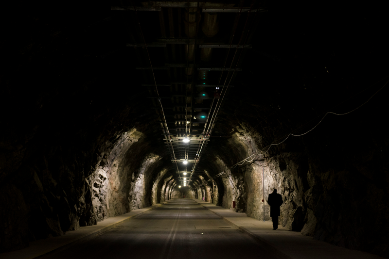A Cheyenne Mountain Air Force Station employee walks to the mountain’s complex almost a mile to get to the blast doors and into the facility. From the mountain’s north portal to its south portal s a 2-mile road through the mountain. (U.S. Air Force photo/Staff Sgt. Andrew Lee)